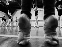 Ballet instructor, and current principal ballerina with the Festival Ballet in Providence, Eugenia Zinovieva, keeps her feet nimble as her students, (L to R) Sadie Marchesseault, 13, Mia Hurley, 14, Natalie Mitchell, 14 and fellow D class perform Tendue Croise Devant floor crossings, during the technical aspects of class at the New Bedford Ballet studio on Purchast Street in the north end of New Bedford.   [ PETER PEREIRA/THE STANDARD-TIMES/SCMG ]